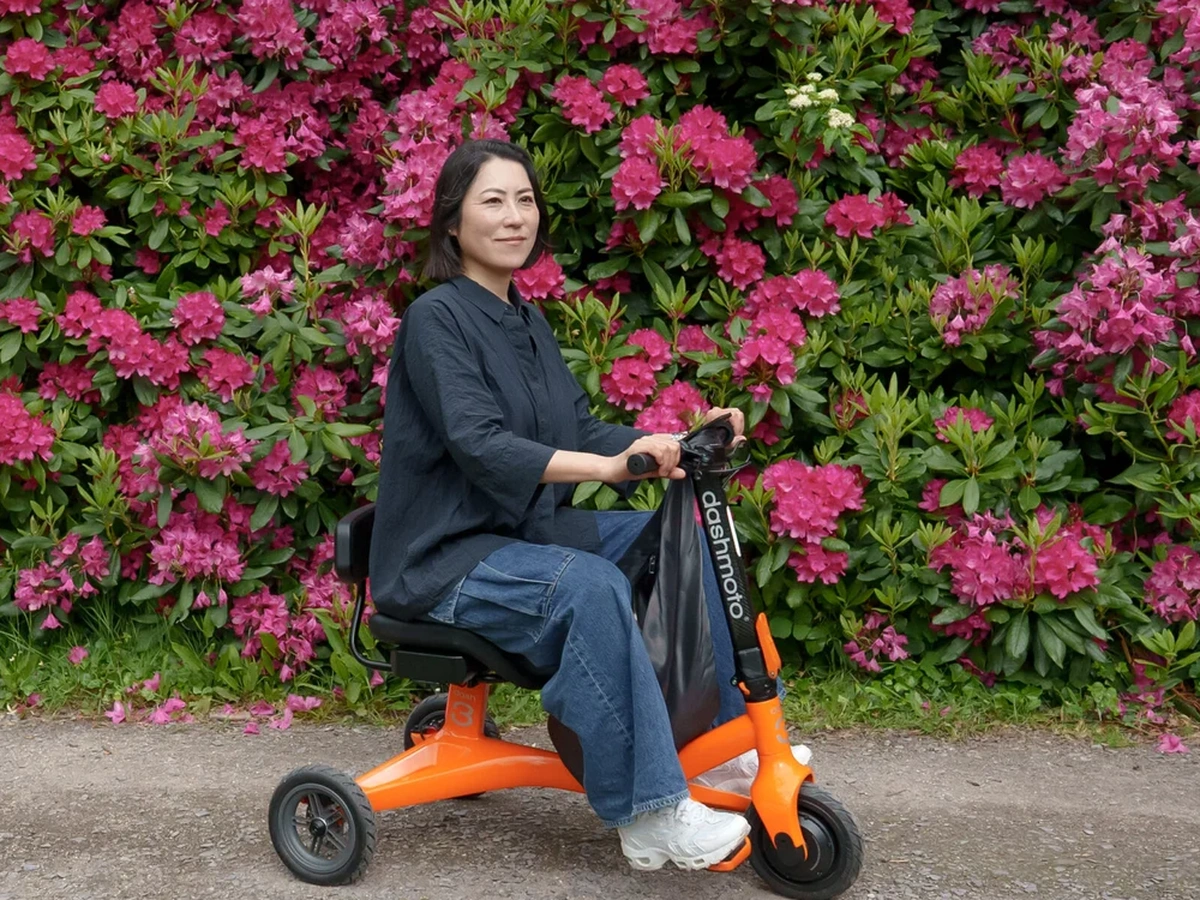 Stylish rider using a DashMoto premium mobility device outdoors