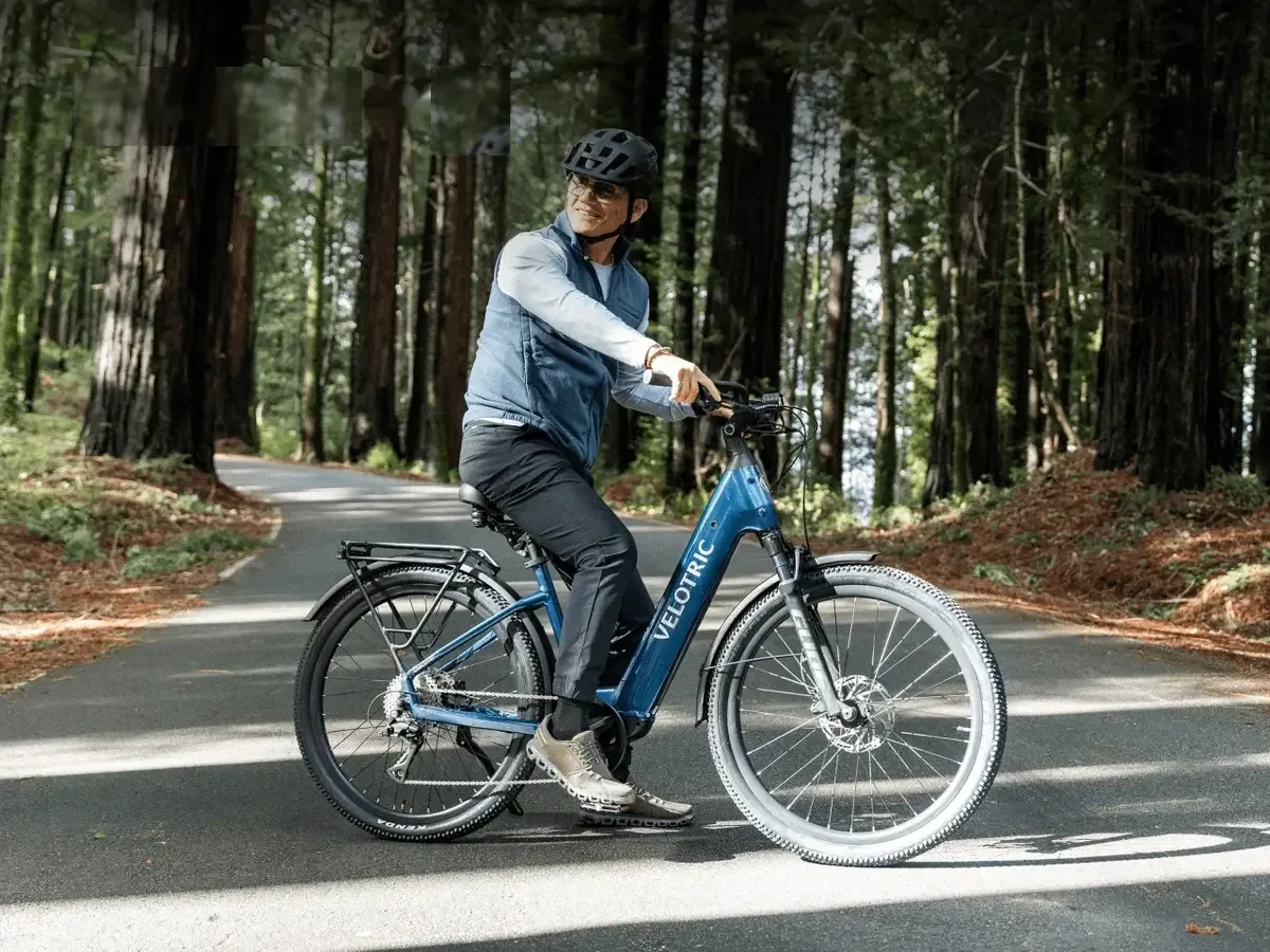 Rider on a supported step-through e-bike